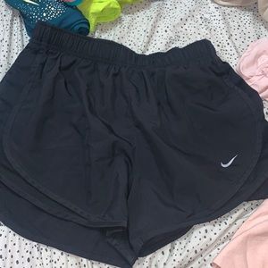 solid black nike shorts, size small